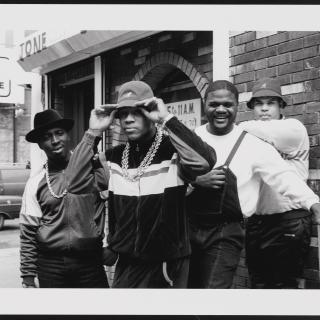 An Image of Image: a black and white image of LL Cool J with Cut Creator, E-Love, and B-Rock
